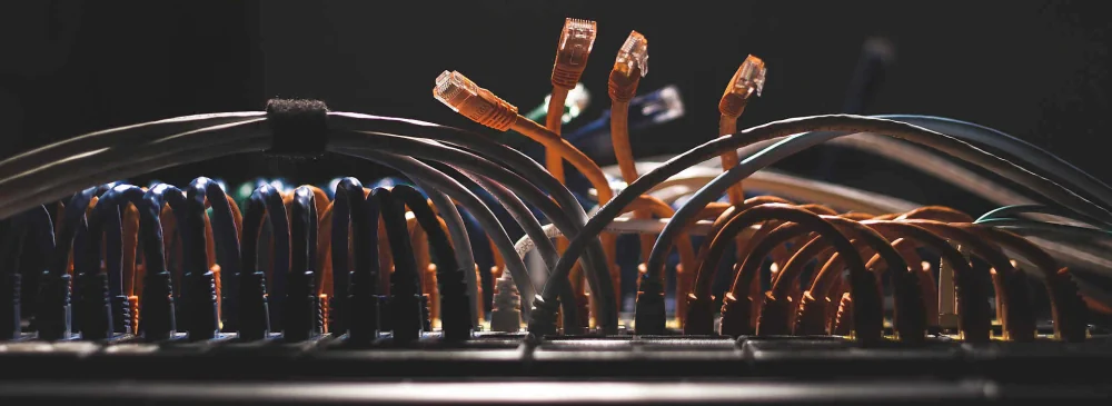 Heading: Disarray of Unplugged Internet Cables Surrounding a Router.